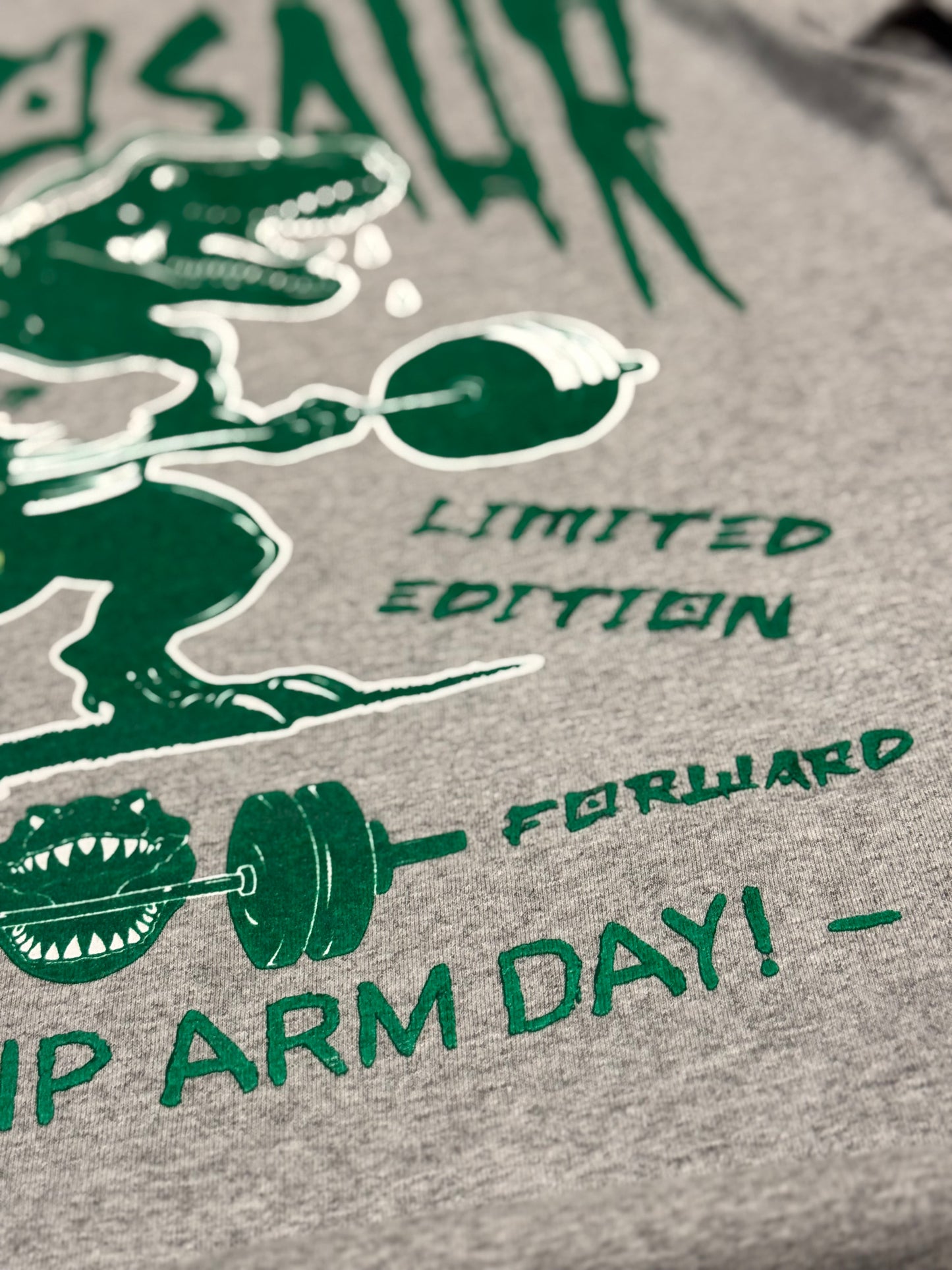 DINOSAURS DON’T SKIP ARM DAY TEE